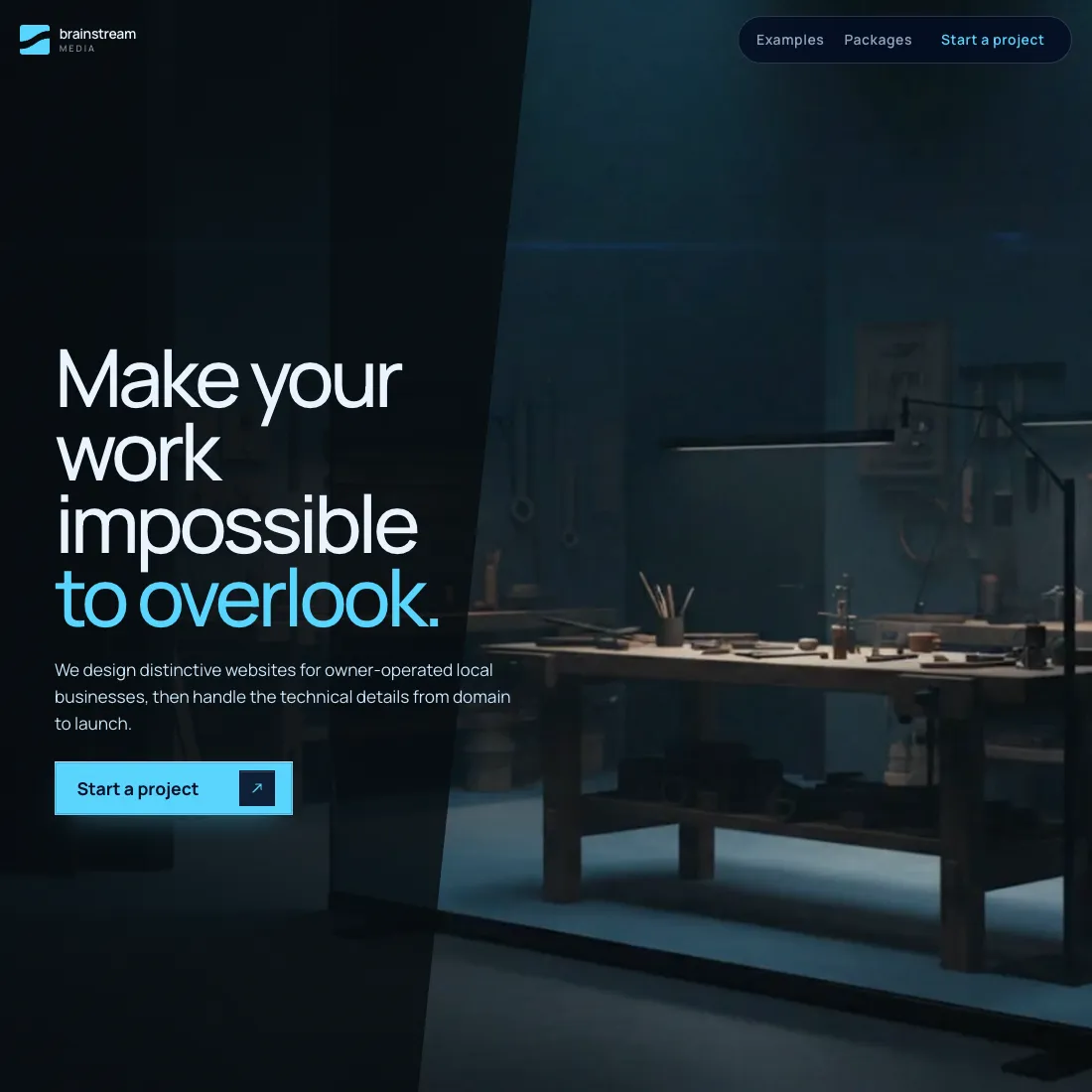 The top of this studio's previous website: a dark page with the headline Make your work impossible to overlook beside a dimly lit workshop.