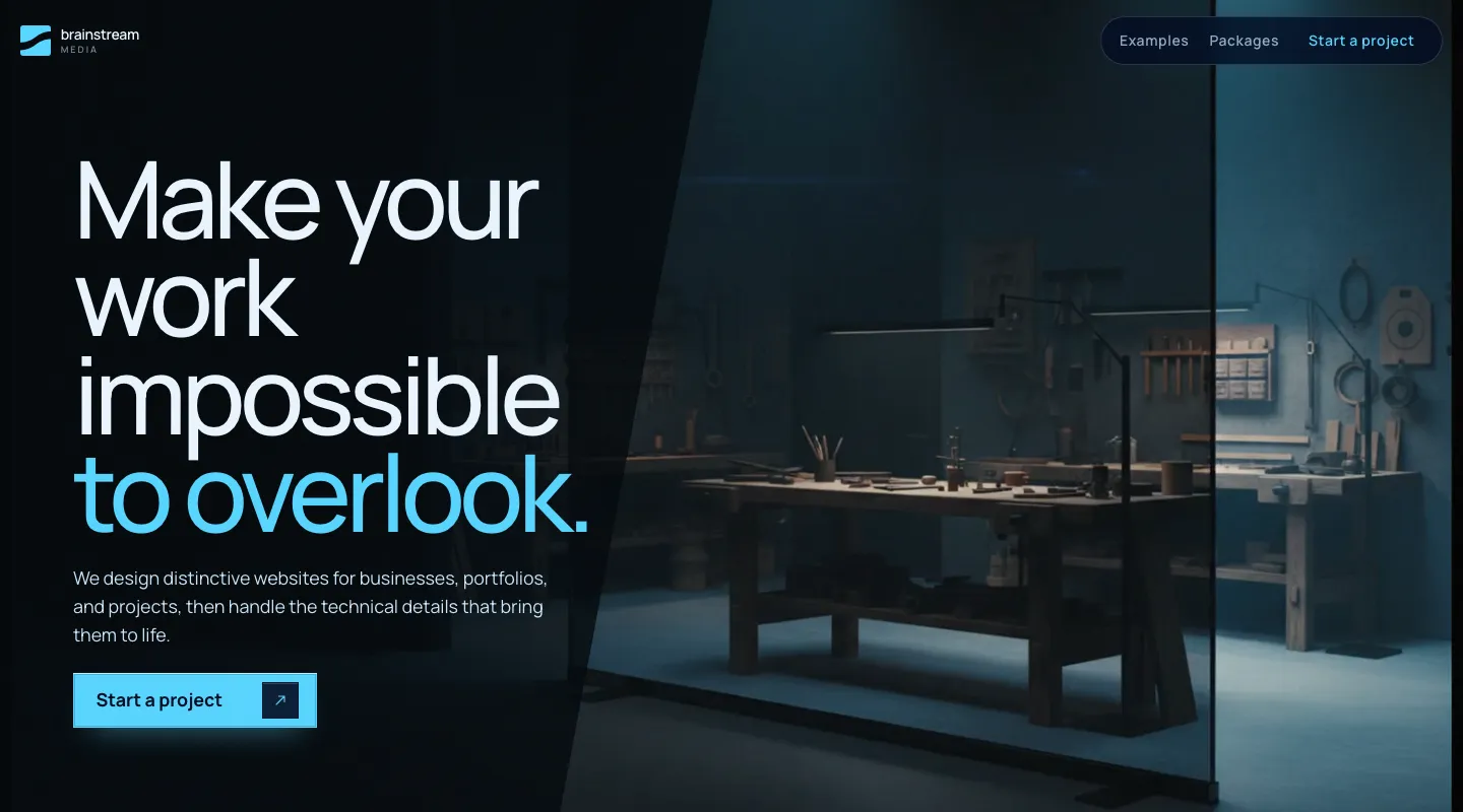 The top of this studio's previous website: a dark page with the headline Make your work impossible to overlook beside a dimly lit workshop.