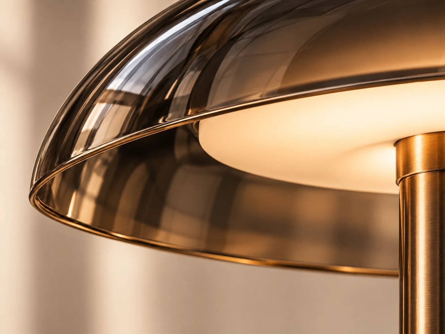 Close detail of the smoked glass shade, bronze edge and glowing diffuser
